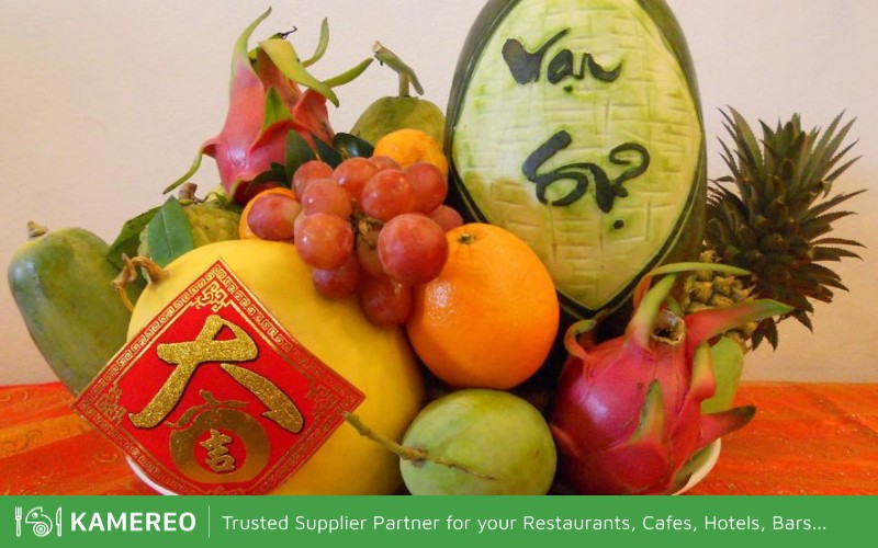 Tet fruit display with watermelon carved with characters