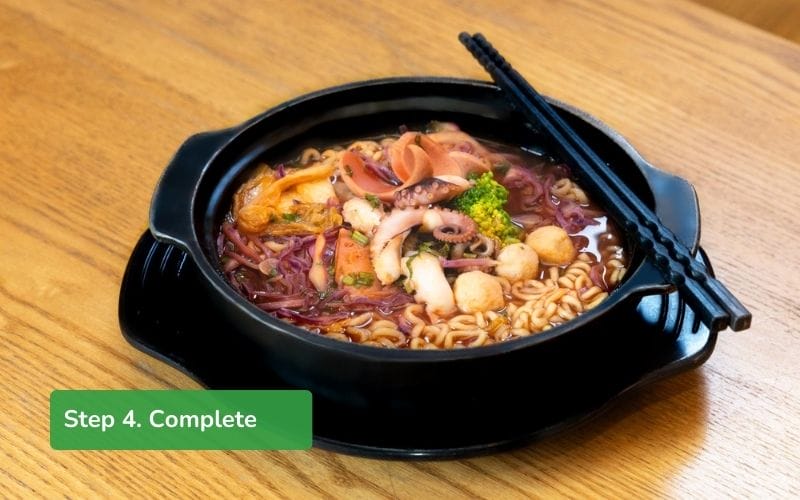 Complete the spicy noodle dish by adding vegetables, kimchi...