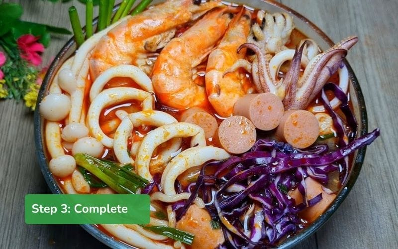 Add seafood and noodles to the earthenware pot, cook until done