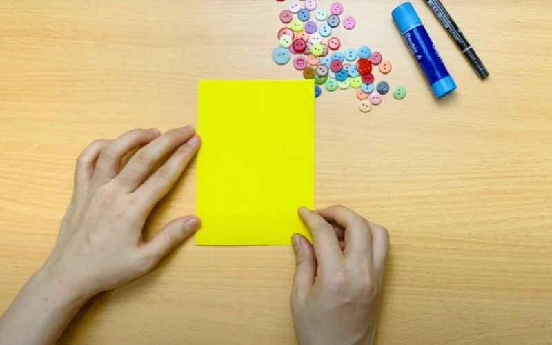 Shaping a lovely card by folding the cardboard in half