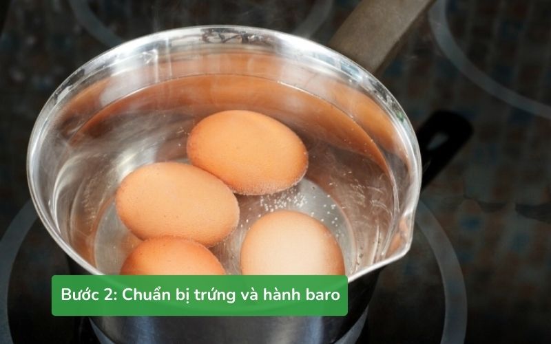 Chuẩn bị trứng luộc, hành baro thái mỏng, rang vừng
