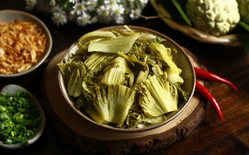 Dưa muối is a traditional naturally fermented dish, harmoniously sour and salty, and good for digestion