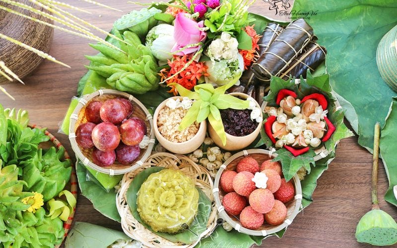 Ancestral Offering Tray for Doan Ngo Festival: vegetarian offerings, sticky rice cakes, wine, flowers, tea, fruits, votive papers