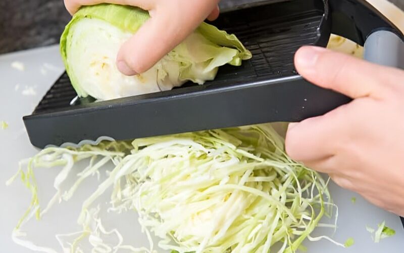 A peeler helps create thin, even cabbage shreds, saving time