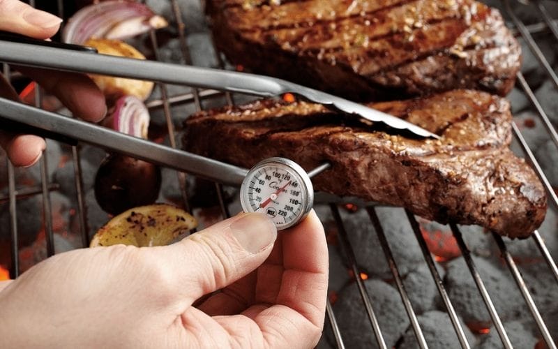 A food thermometer is the most accurate and simplest method to determine beef steak doneness