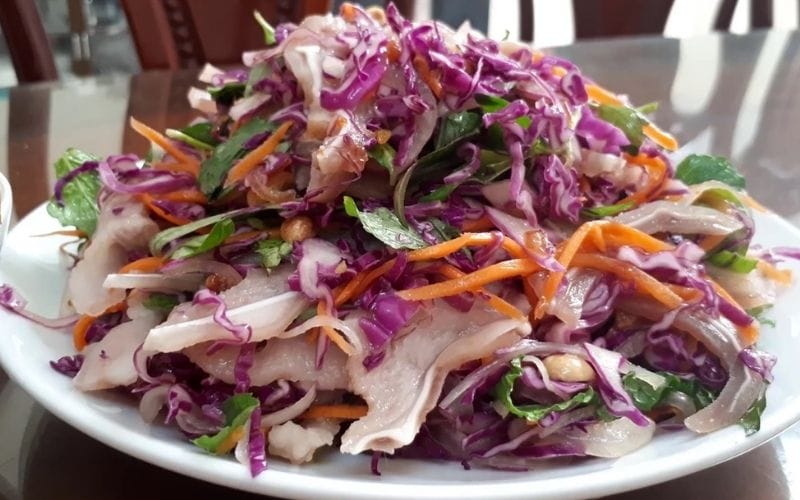 Purple cabbage salad with shredded boiled chicken makes meals more flavorful and nutritious