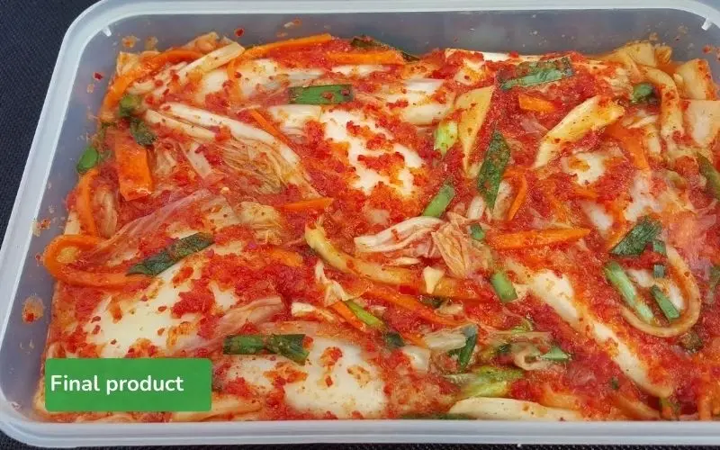 The finished napa cabbage kimchi is vibrant red, crispy, and has a harmonious flavor