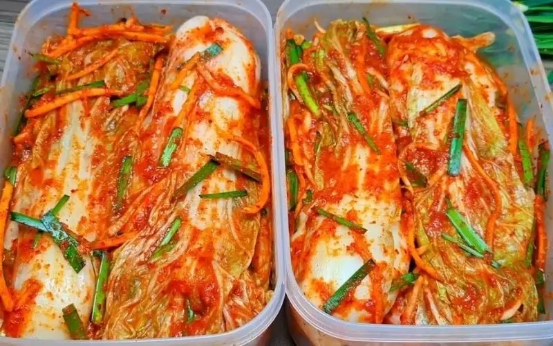 Napa cabbage kimchi is stored in sealed containers in the refrigerator