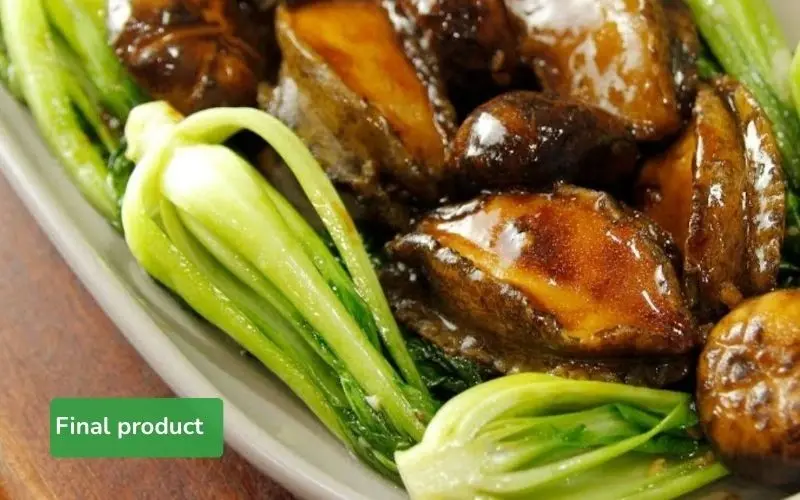 The final dish of abalone stir-fry with bok choy and shiitake mushrooms is rich in flavor