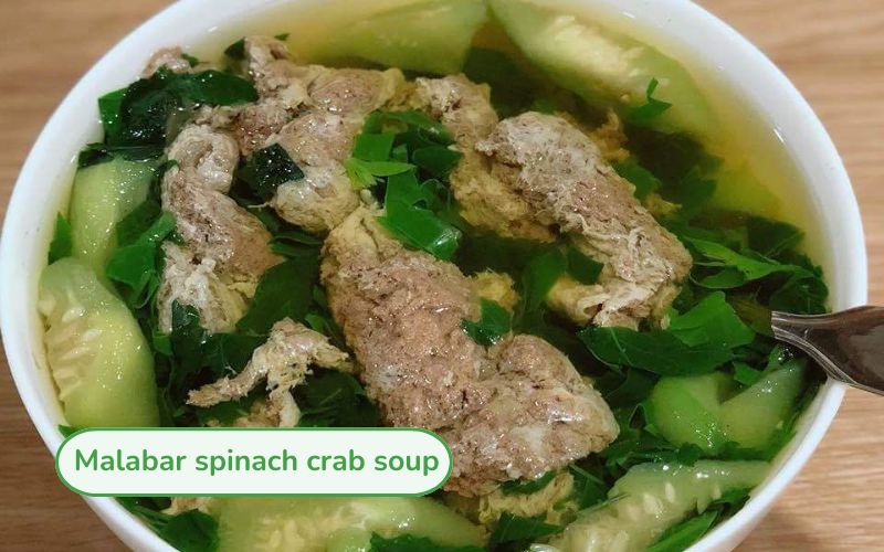 Hot crab and jute soup with yellow crab fat, green squash and soft, attractive jute.