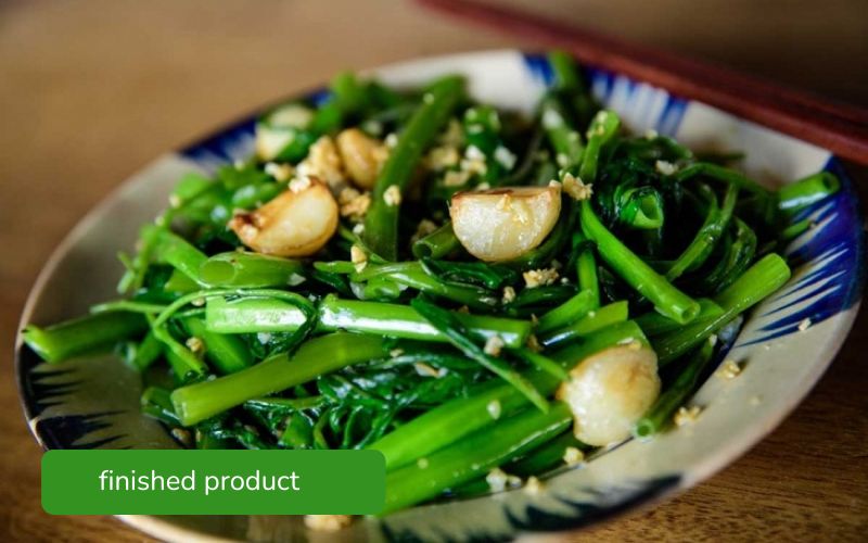 Stir-fried water spinach with garlic, vibrant green and delicious.