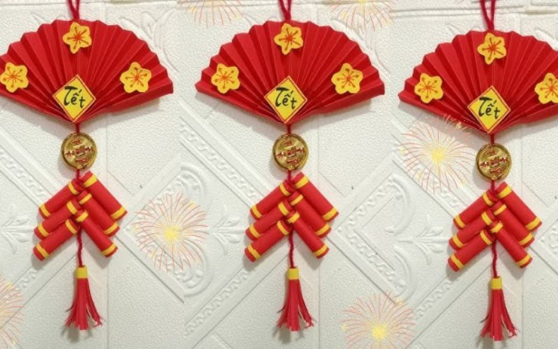 Paper fan with red confetti cannons