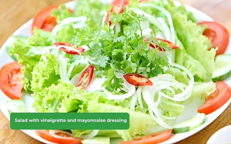 A refreshing and easy-to-eat salad with lettuce, vinaigrette, and mayonnaise dressing.