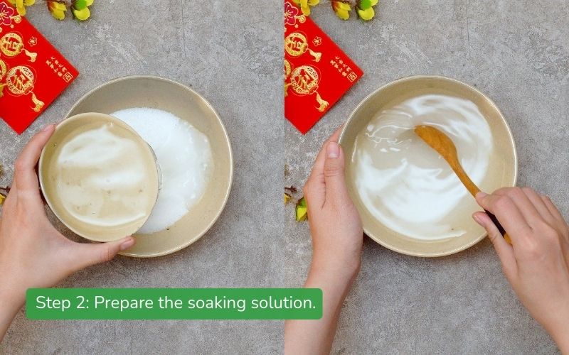A glass of clear, thick salt, sugar, and vinegar solution, ready for soaking the onions.