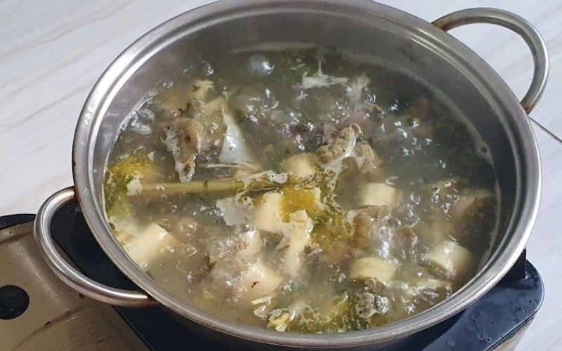 Delicious and appealing chicken hot pot with basil leaves.