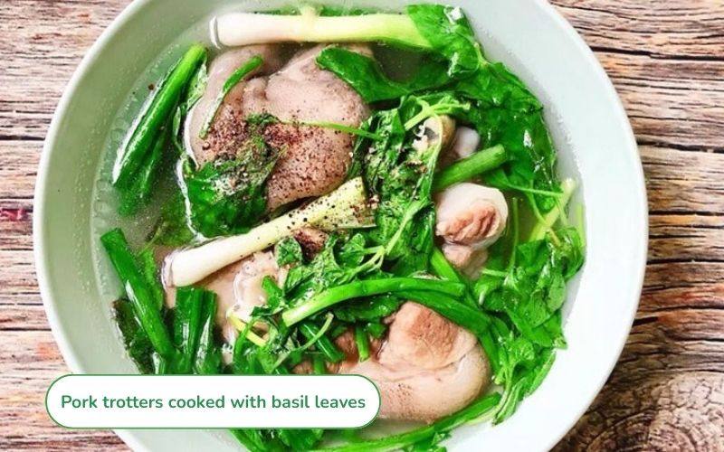 Pork trotters cooked with basil leaves, fragrant and flavorful.